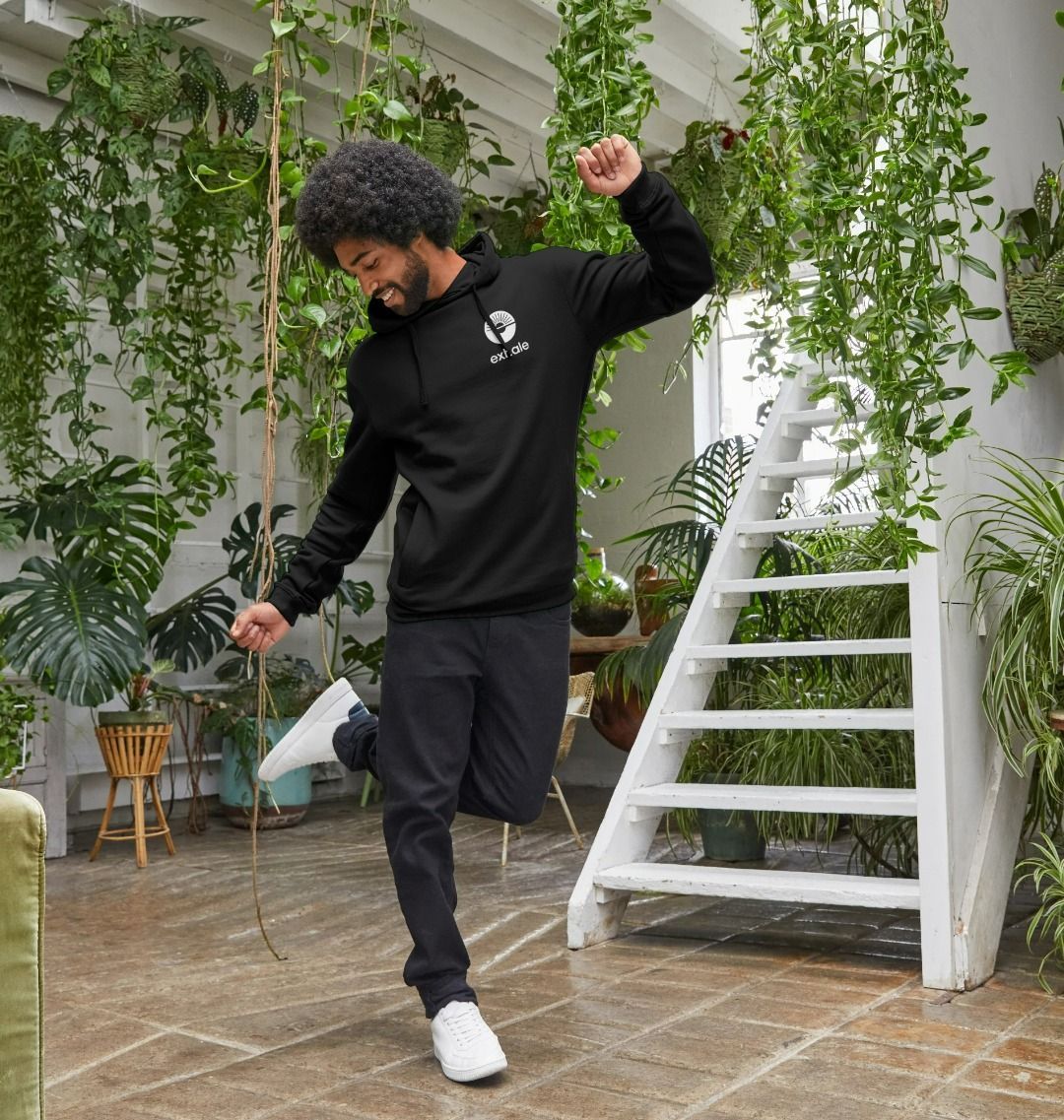 Exhale white logo on a black hoodie