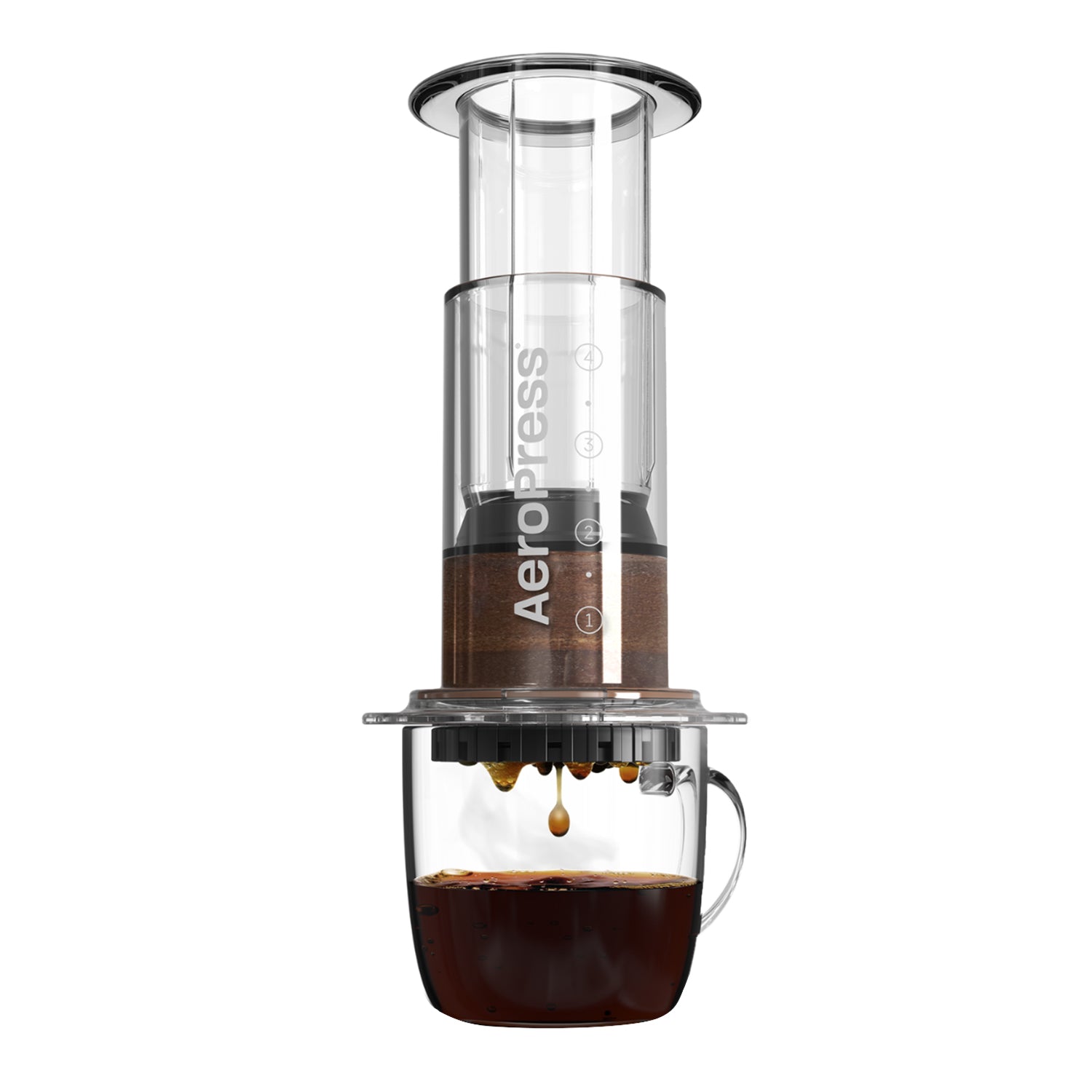 An AeroPress coffee maker with a clear body and a metal filter, shown brewing coffee.